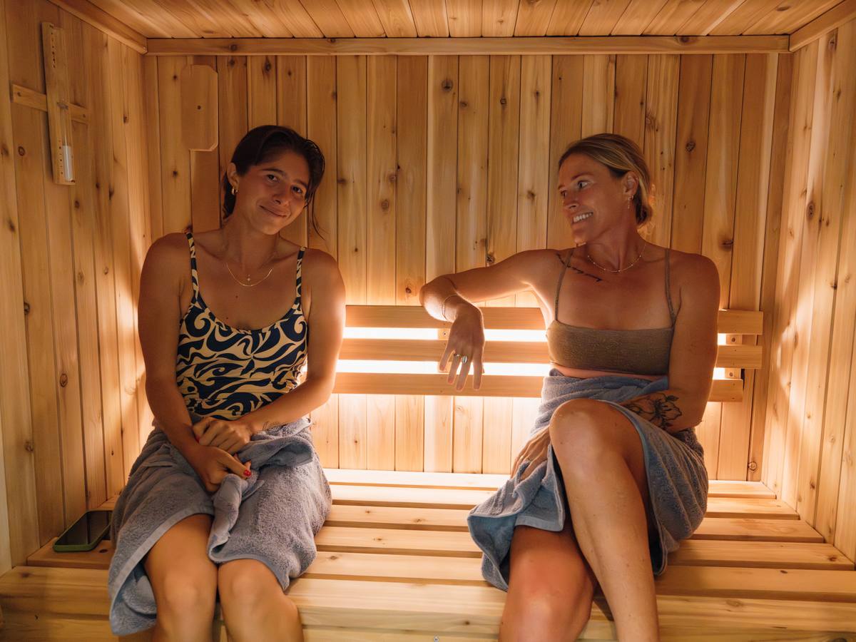 Guests relaxing inside the cedar sauna